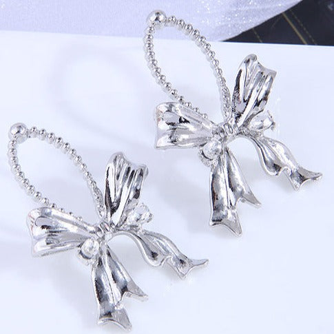 Silver Tone Hanging Bow Stud Earrings E211