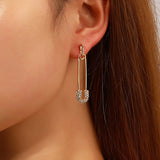 Gold Tone Diamante Safety Pin Stud Earrings E136