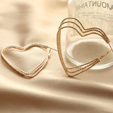 Gold Tone Large Triple Heart Shape Earrings E5