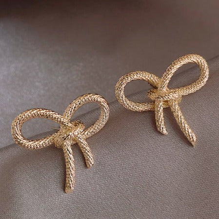 Gold Tone Bow Stud Earrings E175